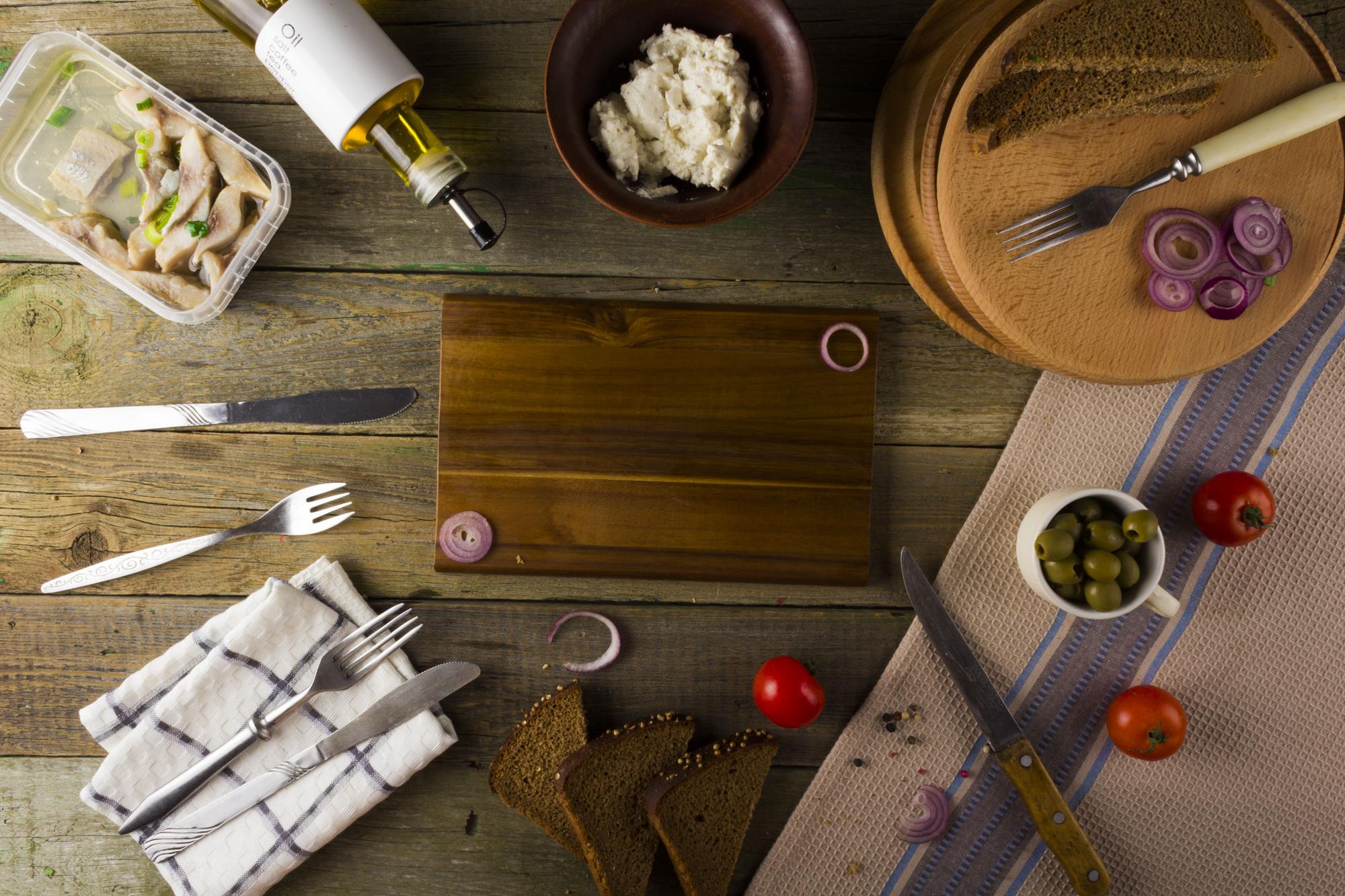 Workspace with wooden boards and plated food